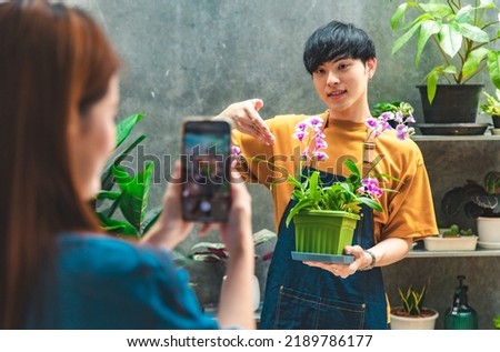 Couple Asian Gardeners are preparing small planters.Hobby of plant, gardening or houseplants of in the greenhouse.Online selling.