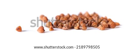 Pile of buckwheat seeds isolated on white background, closeup. Food Royalty-Free Stock Photo #2189798505