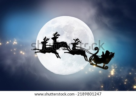 Greeting card with Santa Claus flying across night sky with full moon and stars on sleigh pulled by three reindeer.Santa's black silhouette isolated on magical background.Christmas,New year concept