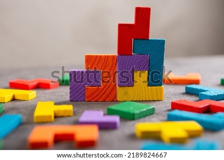 Creative idea solution - business concept, jigsaw puzzle close up. Leadership and teamwork strategy success. Royalty-Free Stock Photo #2189824667