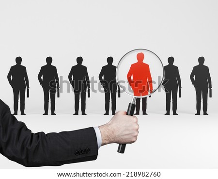 The choice of the best suited employee. Red human sign as a symbol of chosen one by the recruiter. HR, HRM, HRD ,CRM concepts. 
