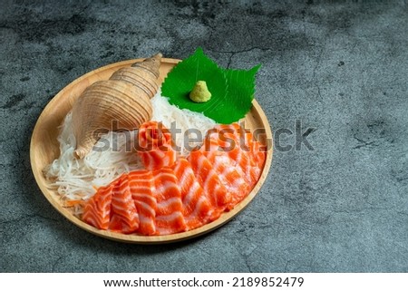 set of fresh raw salmon on wooden board disk with wasabi copy space, Fresh Salmon fish fillet.