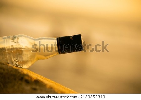 A bottle in a sunset 