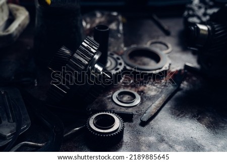 Mechanical parts of car in car repair shop. dark tone.
