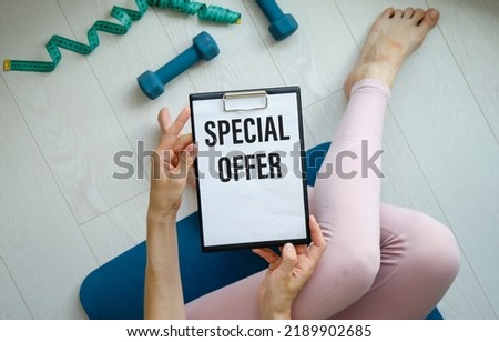 SPECIAL OFFER text on clipboard in hands, concept closeup. Business and sport concept.