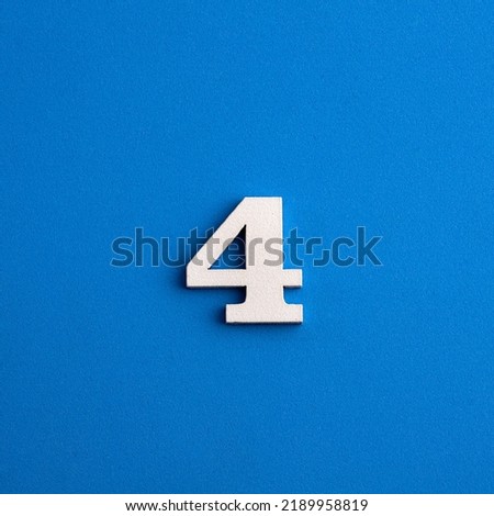 Number 4 in white on blue foami background