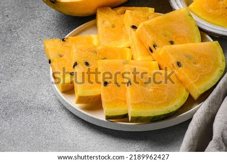 yellow watermelon on a gray background. High quality photo