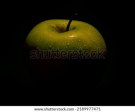 Granny Smith green apple with water drops