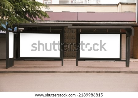 Blank advertising boards on transport stop. Space for design