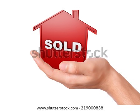 hand holding red sold house. sale concept  isolated on white background