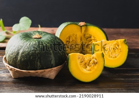Green pumpkin on wooden background, Organic vegetable