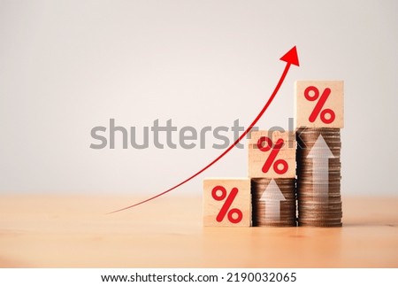 Increasing coin stacking with up arrow and percentage sign for increase financial interest rate and business investment growth from dividend concept. Royalty-Free Stock Photo #2190032065