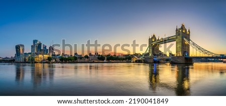Tower Bridge and finance district panorama at dawn in London