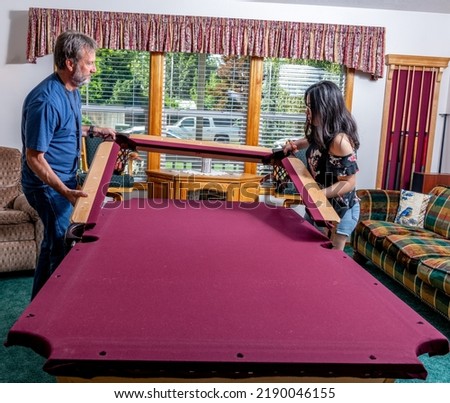 Poole table to with red felt is taken apart to be moved Royalty-Free Stock Photo #2190046155