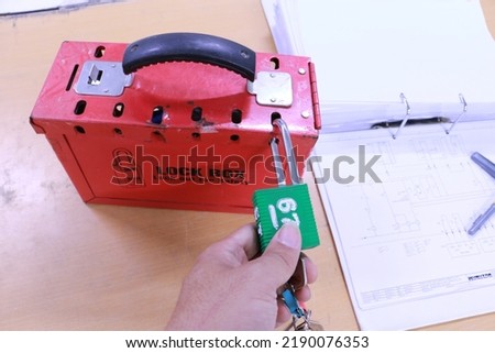 Lock box and switch gear room background ,Lockout Tagout , Electrical safety system.Key lock switch or circuit breaker for safety protect.in electric room Royalty-Free Stock Photo #2190076353