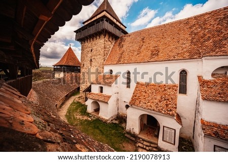 Viscri, Romania: Blue old painted traditional house from village, Transylvania, German Saxon community. Unesco. The Viscri fortified church Royalty-Free Stock Photo #2190078913
