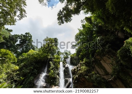 Beautiful waterfall in rain forest. Mok Fa Waterfell Changmai Thailand.