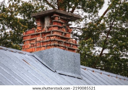 Desolate old chimney with heavily weathered bricks. Royalty-Free Stock Photo #2190085521