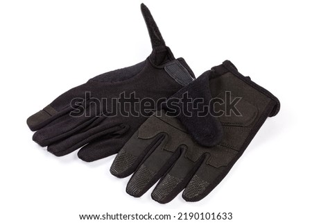 Pair of the black tactical military gloves made with textile and synthetic leathern on a white background
 Royalty-Free Stock Photo #2190101633