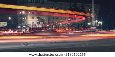 Road car light streaks. Night light painting stripes. Long exposure photography. A photo using a slow shutter speed to capture the lights on a highway. Royalty-Free Stock Photo #2190102155