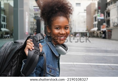 african american college student in city, scholarships to study abroad, Happy woman smile portrait, young college girl. Scholarship, exchange student urban concept. work and travel after graduation. Royalty-Free Stock Photo #2190108327