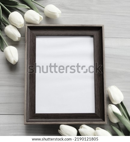 photo frame has tulips for the background.