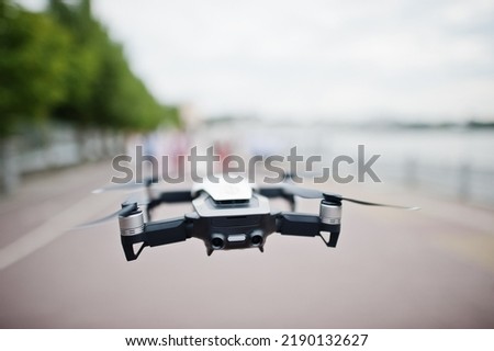 Drone quad copter flying with digital camera.