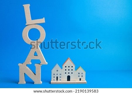 Loan letter and house arranged vertically and photo on the left with a blue background