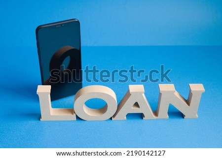 Centered front-facing photo on blue background with smartphone behind left of loan letters