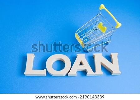Centered photo on a blue background with the cart on the top right of the loan text