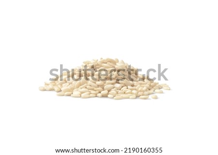 Close up of a heap of white sesame seeds on a white background Royalty-Free Stock Photo #2190160355