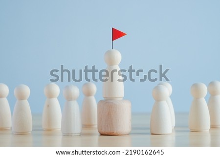 Leadership concept. Wooden figure leader with red flag. Successful team with excellent leader. human resources management. human development business concept.