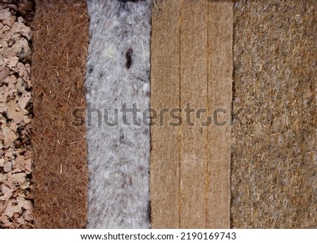 Various ecological insulations: cork, sheep wool, wood fiber, coconut fiber Royalty-Free Stock Photo #2190169743
