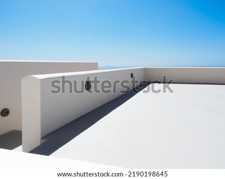 White painted rooftop with blue sky on Santorini, Greece Royalty-Free Stock Photo #2190198645