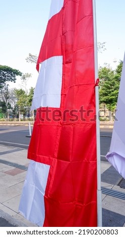 The red and white national flag of Indonesia began to be flown before the commemoration of independence day. The red color means brave, while white means holy.