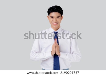 Happy young asian businessman to pay respect with hands isolated on white background, symbol of Thailand, happiness man with confidence, one person, business concept. Royalty-Free Stock Photo #2190201767