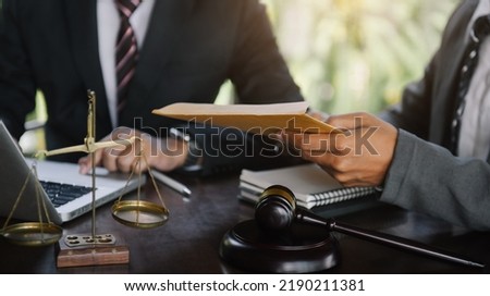 Business people and lawyers discussing contract papers sitting in the table at office in the morning. concepts of law, advice, legal services.