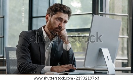 Tired lazy napping yawn adult bearded man male manager worker bored at work project online in computer in office Caucasian mature ill businessman need energy asleep feel overworked exhaustion Royalty-Free Stock Photo #2190219763