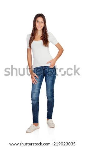 Smiling young girl with jeans standing isolated on a white background