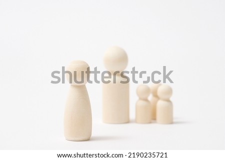 Image of the divorce, the wooden miniature dolls in white background