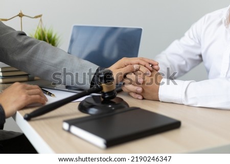 Justice and attorney concept. Lawyer meeting and consoling solution to his client provide legal advice and trust commitment strain serious for problem. Royalty-Free Stock Photo #2190246347