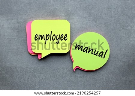 Employee Manual text on colorful stickers. grey background