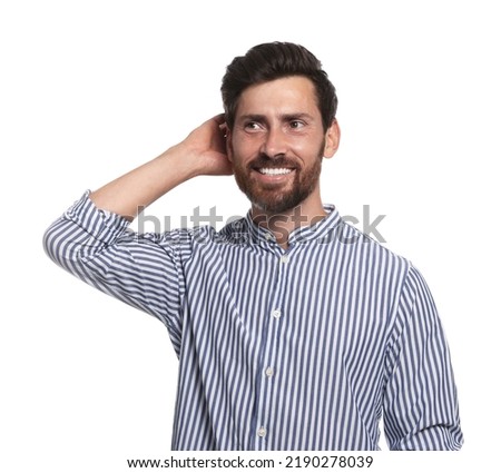 Portrait of smiling bearded man on white background
