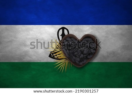 Wooden basket heart form on background of national flag. Photography and marketing digital backdrop. Lesotho
