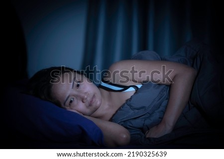 Asian women have a high concern that is why she can't sleep.Have stress from work Royalty-Free Stock Photo #2190325639