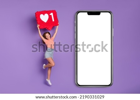 Full length body size view of pretty cheery trendy girl jumping showing like board sign isolated on bright violet purple color background
