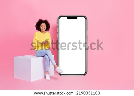 Full size photo of young lady use cellphone sit platform fast connection 4g blogging isolated over pink color background