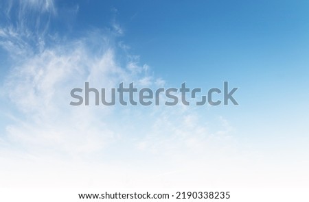 Beautiful cyan and white sky background gradient, fluffy abstract clouds on blue heaven backdrop in morning in summer season. Light cloud in a good weather day. Natural lanscape environment in the air