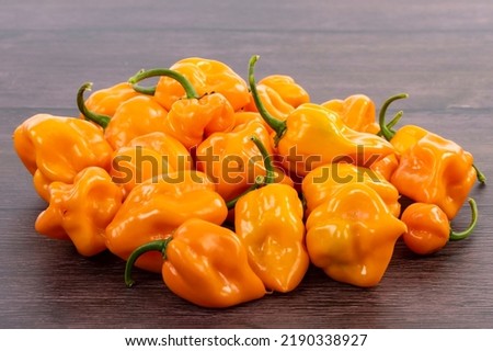 Bunch of Yellow Habaneros or Scotch Bonnet Peppers Closeup Royalty-Free Stock Photo #2190338927