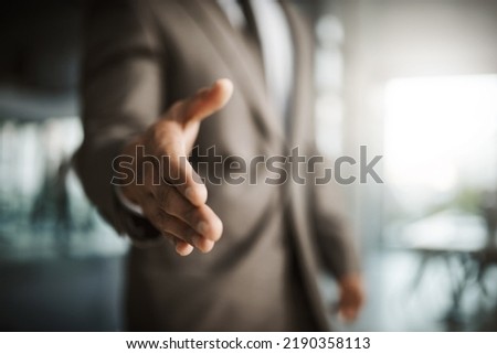 Closeup of professional executive businessman reaching for handshake to thank you for formal interview meeting. Corporate company manager hiring new employee in leadership development Royalty-Free Stock Photo #2190358113